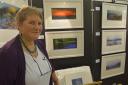 Tricia Meynell in front of her some of her work at Dacre Hall