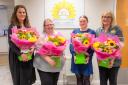 Hospice at Home West Cumbria staff were gifted bouquets along with the donation
