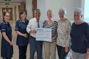 The handover of the cheque to the West Cumberland Breast Cancer Clinic