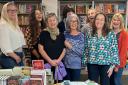 Louise alongside her staff at The New Bookshop