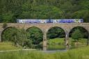 A Northern Rail train passes over Eden Lacy viaduct on the Settle to Carlisle railway line, July 8, 2019