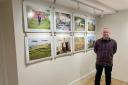 Photography lecturer Rob Sara with his work in the Vallum Gallery