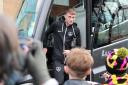 Owen Moxon leaves the Portsmouth team coach after arriving back at Brunton Park
