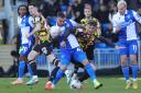 Taylor Charters tangles with Bristol Rovers' Jack Hunt during Carlisle's defeat