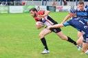 Two tries to his name: Gordon Maudling beats the Coventry Bears full-back to score