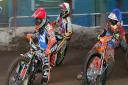 Claus Vissing and Matt Williamson head into the first turn with Redcar's David Bellego on the outside