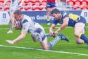 Crossing the whitewash: Town’s Jake Moore powers over to score one of his two tries (Photo: Gary McKeating)