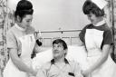 Bedside manner: Carlisle United’s skipper Willie Carlin recovering from an appendix operation in 1967 pictured with nurses Dorothy Mackie and Maureen Watson