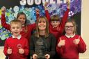 Katy Walker accepted the award alongside some of the school's Year 3 pupils