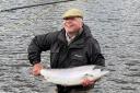 Angler Ken Dyson brings ashore his latest catch