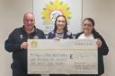 Claire and Wayne presented a check to Hospice at Home West Cumbria after making the prize draw on November 3