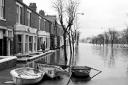 The scene in Warwick Road, Carlisle, looking out of town in 1968 as water from the River Eden sweeps across towards Botcherby