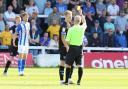 Callum Guy is shown the yellow card at Hartlepool (photo: Barbara Abbott)