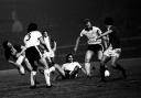 Icons: George Best is on the floor as Bobby Moore tries to close down Carlisle United in the Craven Cottage clash