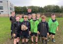 COACHING: Workington Town captain Jamie Doran with Workington Academy pupils who have been learning the fundamentals of rugby league