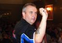 POWER: Phil Taylor at the oche in the Market Hall, Egremont
