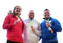 Nick Miller, centre, with his gold medal (photo:s: PA)