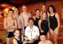 20031106    Eleanor Walsh Presentation
Founder of the Cockermouth Swimming Club,coach Eleanor Walsh was presented with gifts,when the club celebrated its 25th anniversary,seen here is Eleanor, with some of her swimmers.
Pic Stan Partleton         Copy