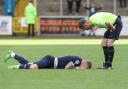 Callum Guy is down in pain late in the Crewe game (photo: Ben Holmes)