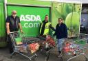 Carlisle Foodbank volunteer Tom, left,Asda Driver Fraser and Carlisle Foodbank Manager Steph Humes with the first of four food donations from Swansway Motor Group.