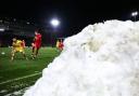 Snow beside the pitch during Leyton Orient's clash with Sutton United on Saturday