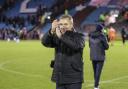 Paul Simpson applauds the fans after the 5-1 win