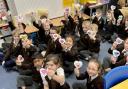 Children showing their hearts at Norman Street Primary School
