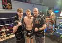 17-year-old Muay Thai fighter Matty Mcleish celebrates a victory with his father Matty Mcleish Snr.