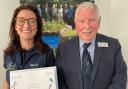 Laura Binnie, small animal vet and sustainability lead at Paragon, receiving the award from Chair of Cumbria in Bloom, Ronnie Auld