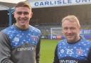 Harrison Neal, left, with Paul Simpson after signing for the Blues