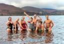 Cumbrian cold-water author Sara Barnes, third left, pictured in Derwent Water with fellow cold water swimmers