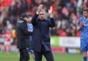 Paul Simpson applauds United's travelling fans after the defeat at The Valley