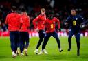 Jarrad Branthwaite, third from right, takes part in the warm-up before the England-Brazil game