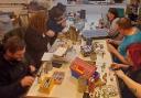 A miniature painting session in full swing at Carlisle Gamers