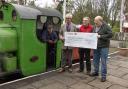 Harold Bowron (sunglasses) presenting the cheque to the South Tynedale Rail Preservation Society