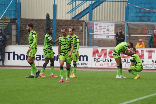 News and Star: Fizz: Nicky Cadden, far right, is congratulated after his goal at Brunton Park (photo: Barbara Abbott)