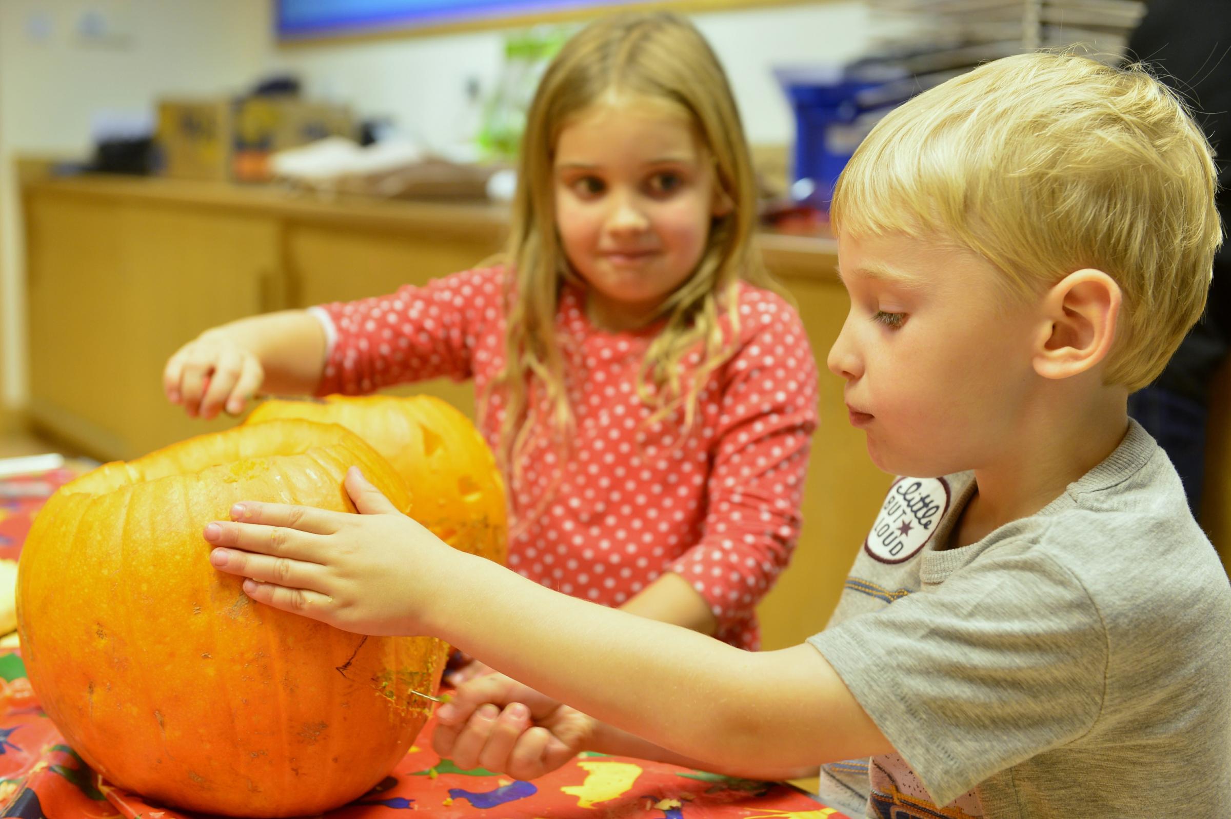 Autumn half term Halloween fun at Tullie House Museum and Art Gallery. A pumpkin carving workshop for children, Hannah, five and Harrison Smith, four from Cotehill, Carlisle carve their pumpkins: 24 October 2016 STUART WALKER 50086030T007.JPG