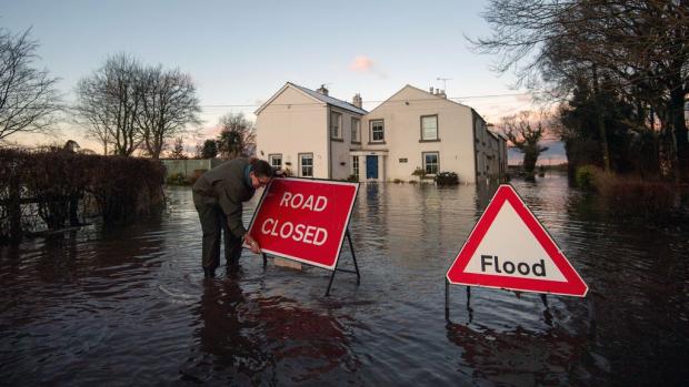 News and Star: Homes at risk of flooding are urged to follow advice from the Environment Agency. (PA)