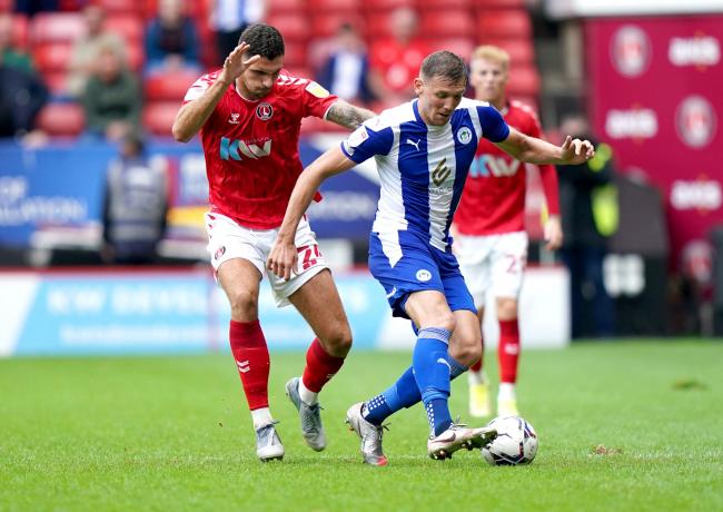 Charlie Wyke, right, collapsed in training with Wigan Athletic earlier this week (photo: PA)
