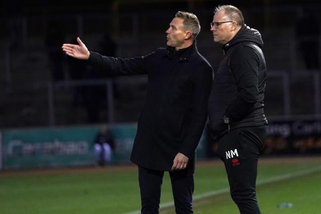 Walsall boss Matt Taylor and assistant Neil McDonald on the touchline during the Carlisle United game (photo: Barbara Abbott)