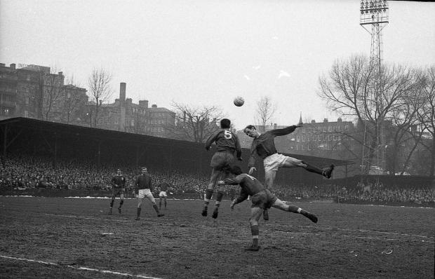 News and Star: United's Peter Garbutt, right, competes in the air at Gay Meadow