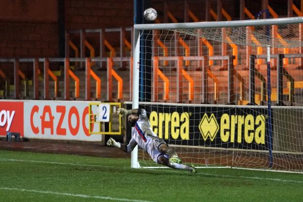 News and Star: The decisive penalty sails over Mark Howard's crossbar as United win the shoot-out 4-3