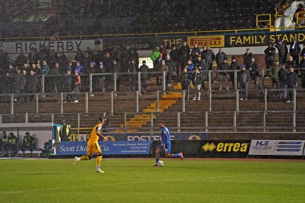 News and Star: Carlisle's Tristan Abrahams takes on Lincoln in front of a small crowd at Brunton Park