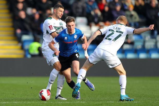 News and Star: Rochdale's Jake Beesley, centre (photo: PA)