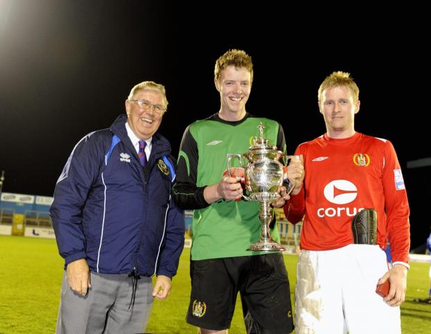 News and Star: Adam Collin, centre, with Workington captain Tony Hopper, right, after winning the Cumberland Cup in 2009 (photo: Stuart Walker)