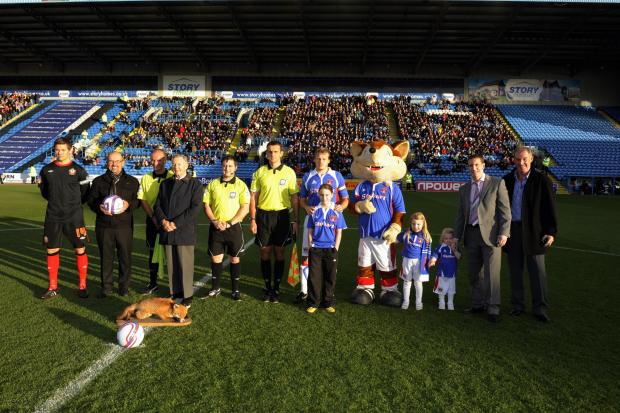News and Star: United captain Frank Simek with officials and mascots before the game
