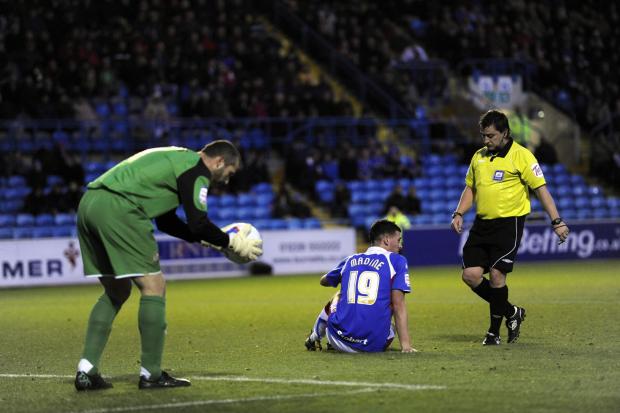 News and Star: Madine hits the deck as Saints keeper Kelvin Davis places the ball