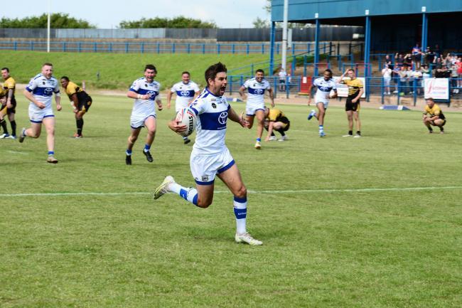 DELIGHT: Carl Forber runs in to score the winning try for Town as the hooter sounds Picture: Gary McKeating