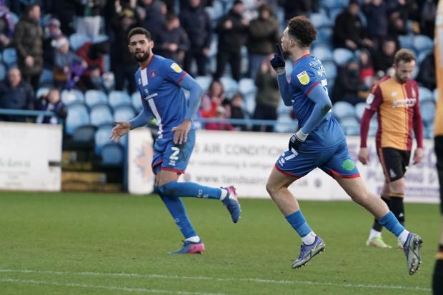 News and Star: Jordan Gibson, right, silences the away fans after his stunning strike