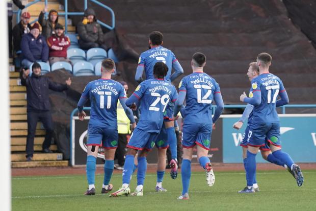 News and Star: United players celebrate in front of the Bradford fans after Gibson's goal
